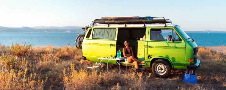 Camper Van Parked with a Scenic Background