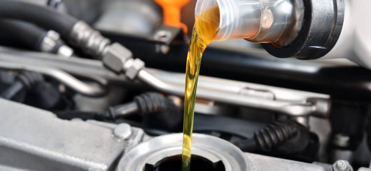 Engine Oil Being Poured From Bottle