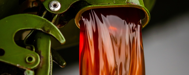 Red diesel pouring from a jerrycan