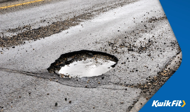 Deep pothole in a road.